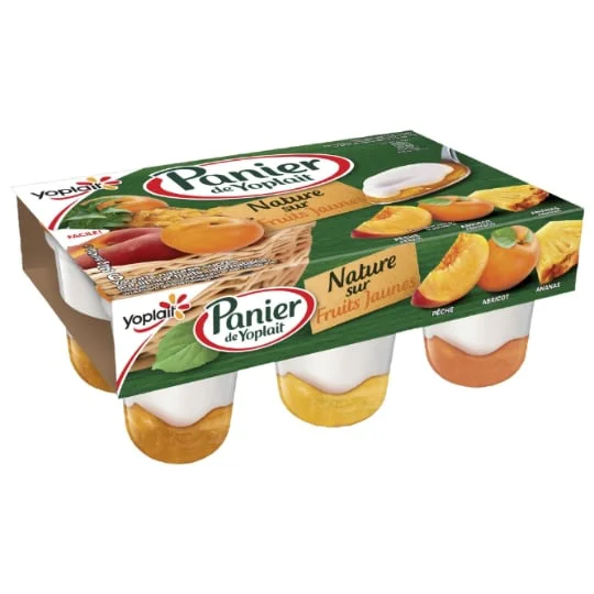 Yaourt nature sur fruits jaunes pêche abricot ananas